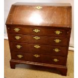 A walnut veneered bureau, herringbone banded, the stepped interior with a cupboard door, drawers and