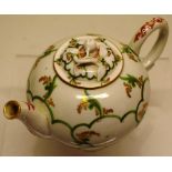 A late eighteenth century Italian teapot, the green gilt spray trellis design body with scroll spout