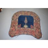 Kerman saddle cover, south east Persia, early 20th century, 2ft. 10in. X 2ft. 11in. 0.86m. X 0.