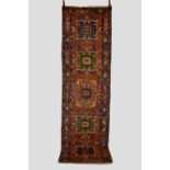 Karaja runner, north west Persia, early 20th century, 10ft. 9in. X 3ft. 1in. 3.28m. X 0.94m.