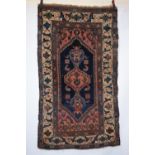 Kurdish village rug, north west Persia, late 19th/early 20th century, 6ft. 6in. x 3ft. 10in.1.98m. x