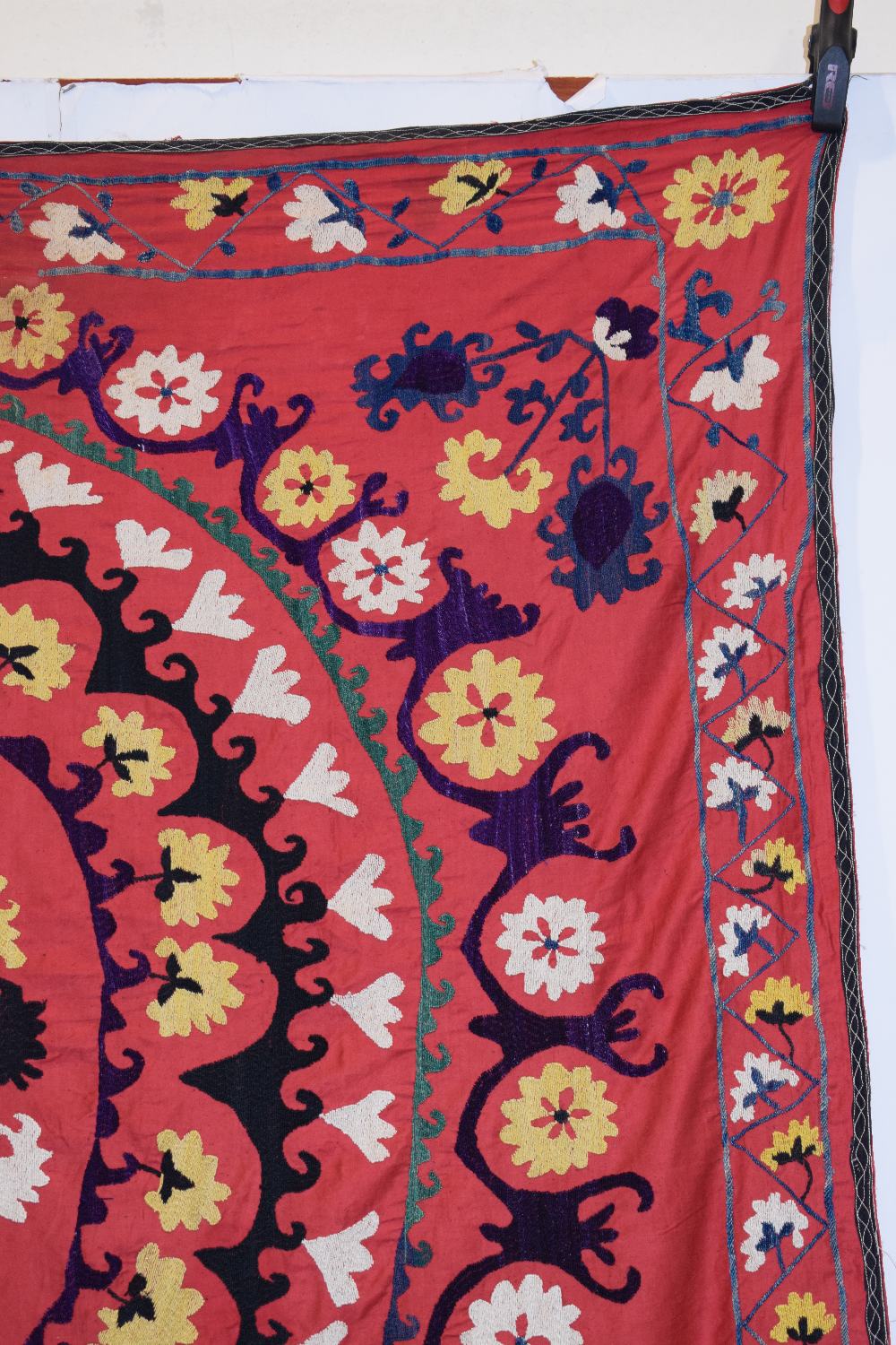 Uzbek red cotton suzani, Uzbekistan, 20th century, embroidered in basma stitch in bright silks, - Image 3 of 8