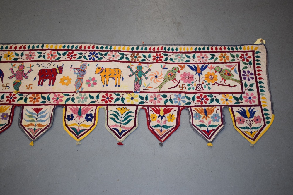 Rajasthan silk embroidered toran, north west India, circa 1930s-40s, 134in. X 17in. 340cm. X 43cm. - Image 7 of 14