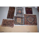 Group of six weavings comprising two Tibetan mats, an Afshar bag face; Kurdish bag face; Baluchi