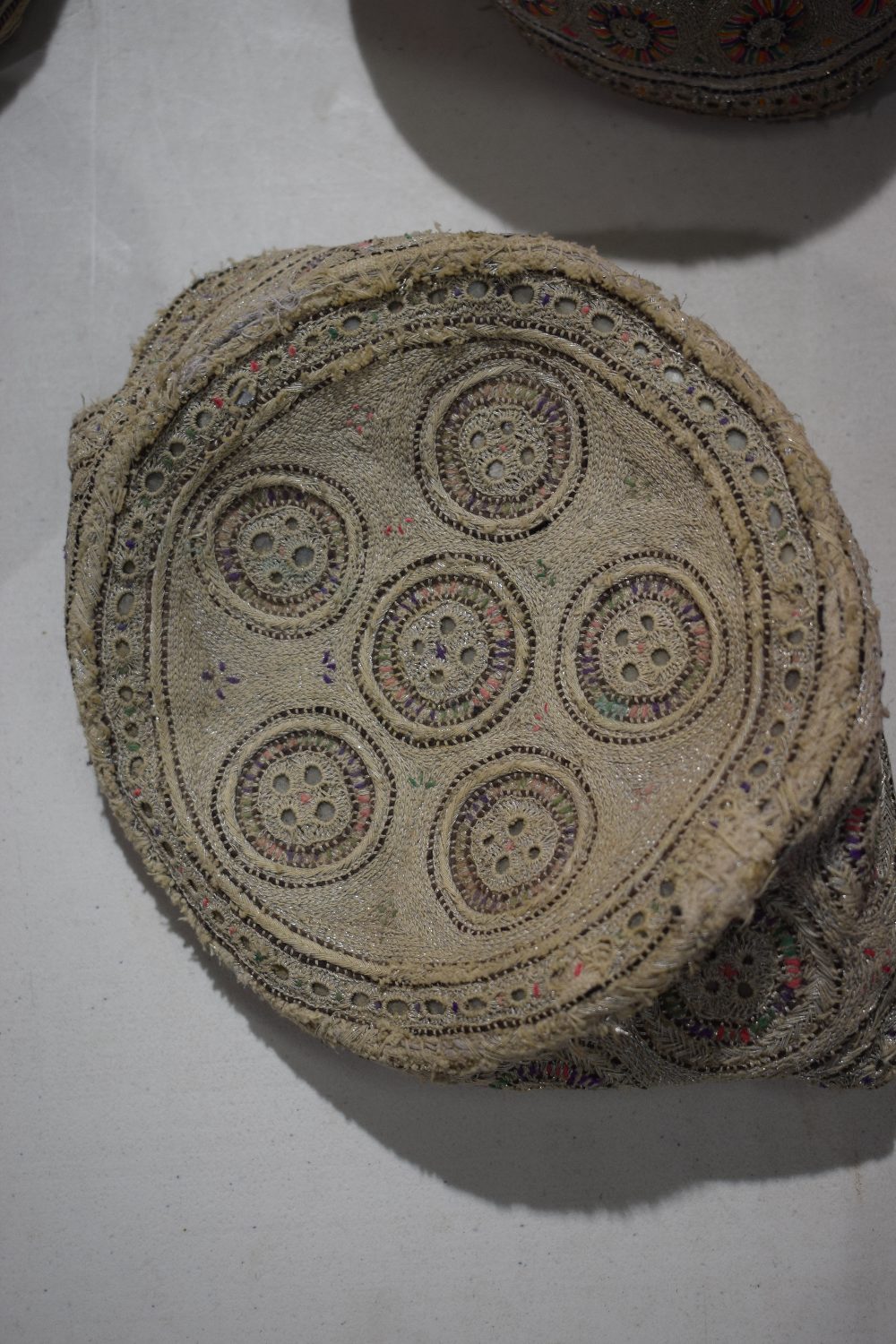 Six Sindhi Baluchi topi (caps), embroidered in coloured silks, metal threads and shisha-work ( - Image 12 of 30