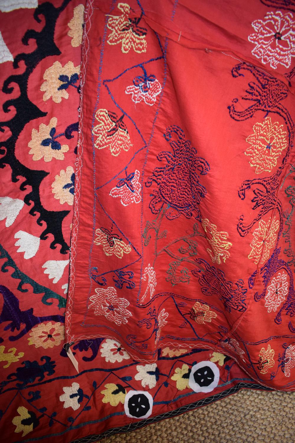 Uzbek red cotton suzani, Uzbekistan, 20th century, embroidered in basma stitch in bright silks, - Image 8 of 8