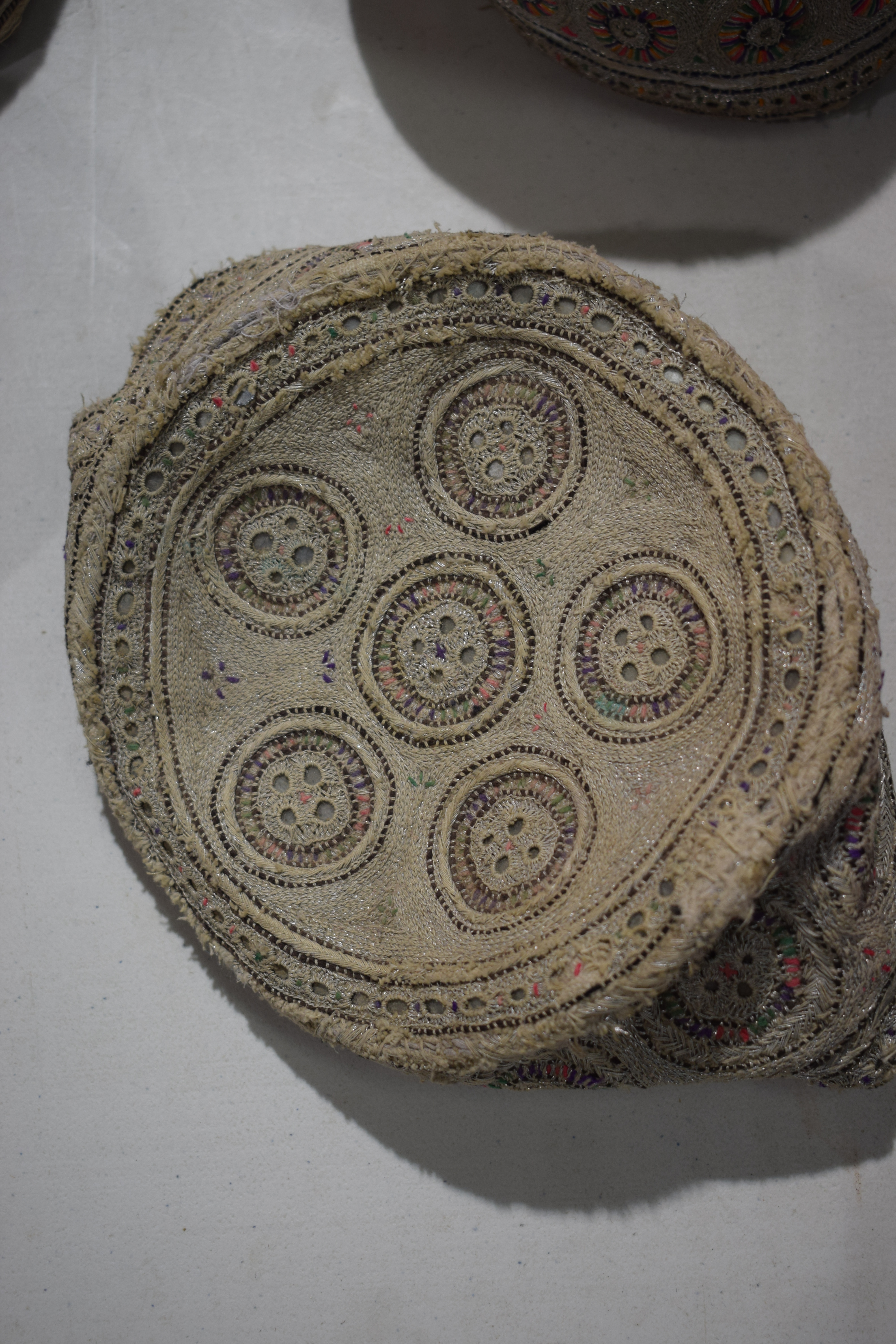 Six Sindhi Baluchi topi (caps), embroidered in coloured silks, metal threads and shisha-work ( - Image 11 of 30