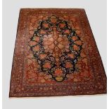 Kashan carpet, west Persia, circa 1920s-30s, 10ft. 3in. X 7ft. 3in. 3.12m. X 2.21m. Dark blue