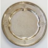 An Austrian silver dish, the broad raised rim with two thematically similar sets of crests,