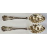 A pair of Victorian silver berry spoons,
