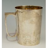 A silver christening mug of slightly tapered form, plain body, by Arnold E Williams,