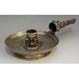 A heavy Victorian chamberstick cast in Renaissance style,