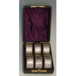 A set of six silver Victorian napkin rings, the bodies engraved with Greek Key bands,