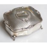 A George V silver dressing table box, the lid diamond textured with fleur de lis,