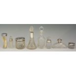 A selection of cut glass dressing table jars and bottles of various designs,