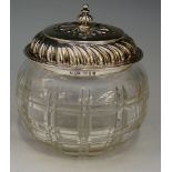 A silver topped spherical dressing table jar, cut glass check pattern body,