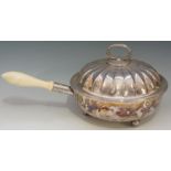 A silver plated server with removable three compartment interior and drip pan, reeded rim,