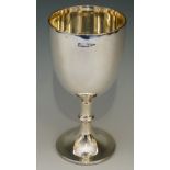 A plain silver goblet, the stem with angular knop, beaded rim to foot, by Walker & Hall,