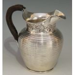 Edward Barnard - a silver jug of conventional form, ribbed body,