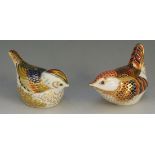 Two Royal Crown Derby paperweights, gilded plumage, one from 1997, the other from 1999,