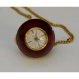 A globe or ball pendant watch, red ename