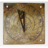 A square brass sundial engraved, the chapter ring with Roman numerals and sun, pierced gnomon,