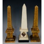 A white marble obelisk, the pedestal inlaid in coloured marbles with oval, diamond and rectangle,