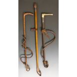 A selection of two hunting whips, one antler handled by Swaine and Adeney,