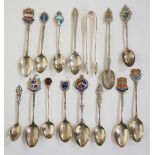 A quantity of silver souvenir spoons, mostly with enamelled crests to handles,