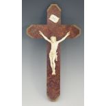 A Victorian carved ivory corpus mounted on a brass framed burr amboyna veneered oak crucifix,