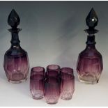 A pair of Art Deco spirit decanters with set of seven matching glasses,