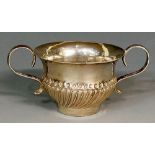 A miniature silver coloured metal porringer,