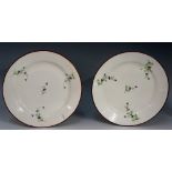 Pinxton - two pattern number 13 circular plates decorated with floral sprigs, manganese rims, 20.