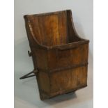 A 19th Century tapered elm grain carrier, the body with wrought iron bands and handle,