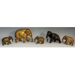A bronzed white metal figure of an elephant with cold painted tusks,
