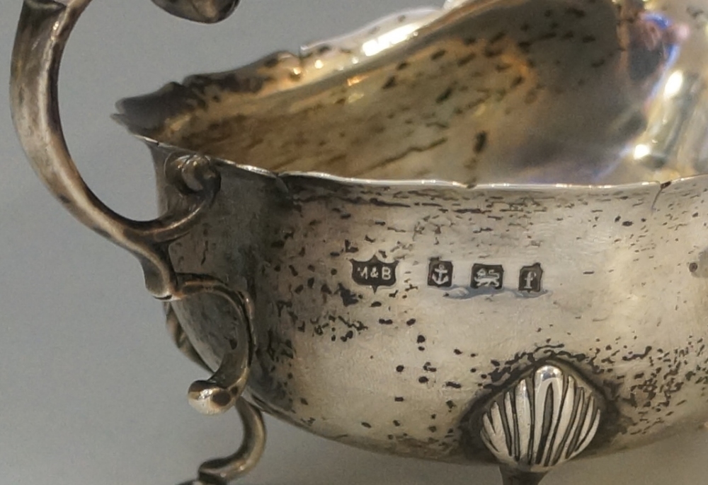A silver sauce boat of conventional form, flying acanthus cast handle, - Image 2 of 2