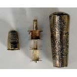 An unusual Chinese silver sewing case in the form of a cane terminal,