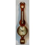 A George III mahogany wheel barometer with thermometer,