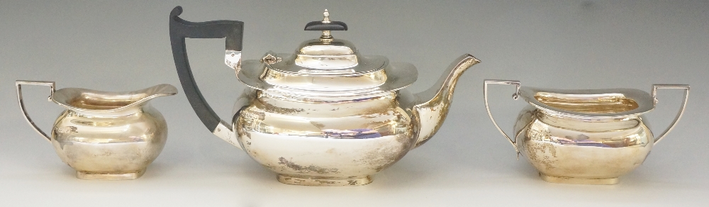 A silver tea set comprising: teapot, cream jug and sucrier,