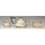 A silver tea set comprising: teapot, cream jug and sucrier,