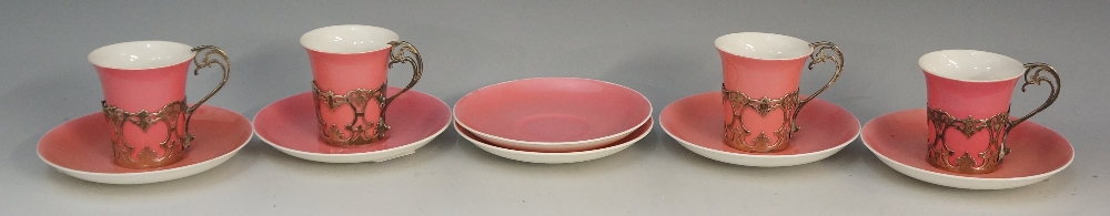 Six Aynsley pink ground saucers together with four matching cups,