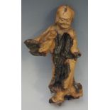 An interesting rootwood figure of an immortal holding a shallow vessel in his right hand,