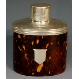 A tortoiseshell tea caddy, the oval body with vacant shield shaped cartouche,