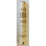 A bone needle case of cylindrical form, pierced and engraved with bands of circles, 9cm long,