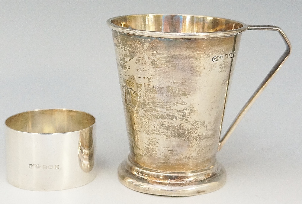 A silver christening tankard, the conical form body engraved with the initials R.C.I.