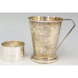 A silver christening tankard, the conical form body engraved with the initials R.C.I.