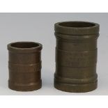 Two Victorian bronze gill measures of cylindrical form with plain bands inscribed at the top