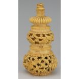 A 19th Century turned ivory novelty of gourd shape, relief carved with birds,