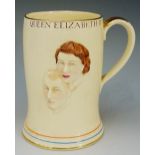 A Crown Devon Fieldings Coronation musical mug, relief moulded with Prince Phillip and Elizabeth II,