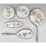 A silver dressing table set, each piece with very pale green enamel above engine turned detailing,